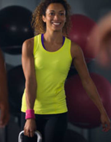 Gym member kettle-bell exercise Gym member kettle-bell exercise