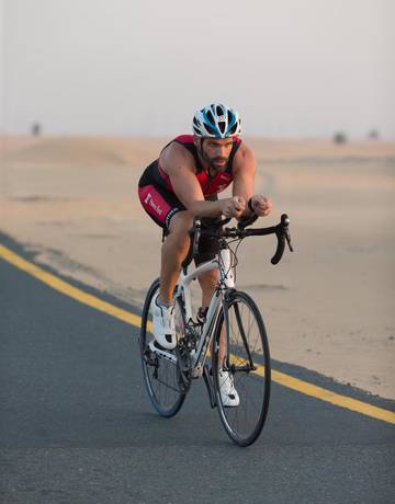 Fitness First member riding a bicycle