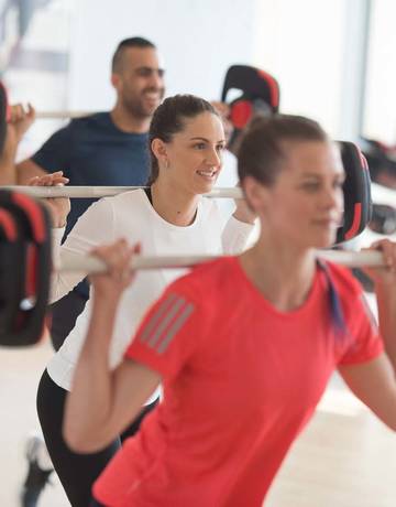 Weight bar squat group exercise