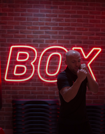 Fitness first member during boxing exercise