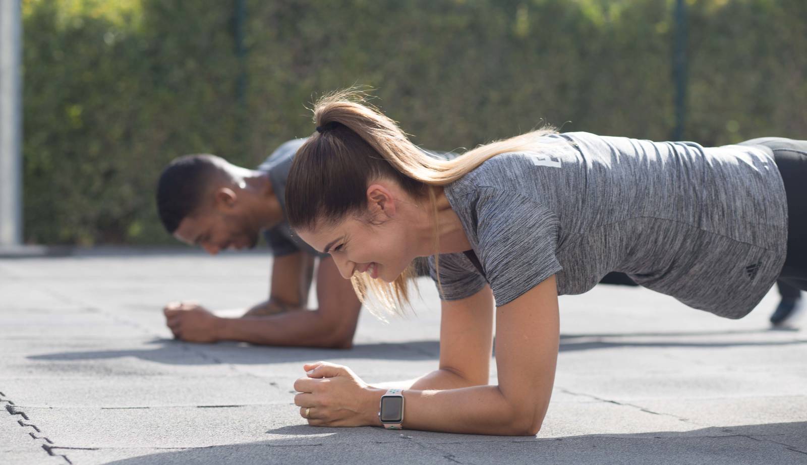 personal trainers during a push-up workout