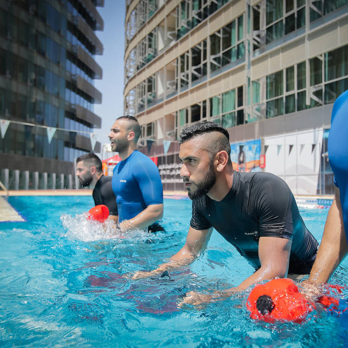 Focused Fitness First member during a Hydro class Focused Fitness First member during a Hydro class