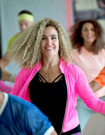 women in a group dance class women in a group dance class